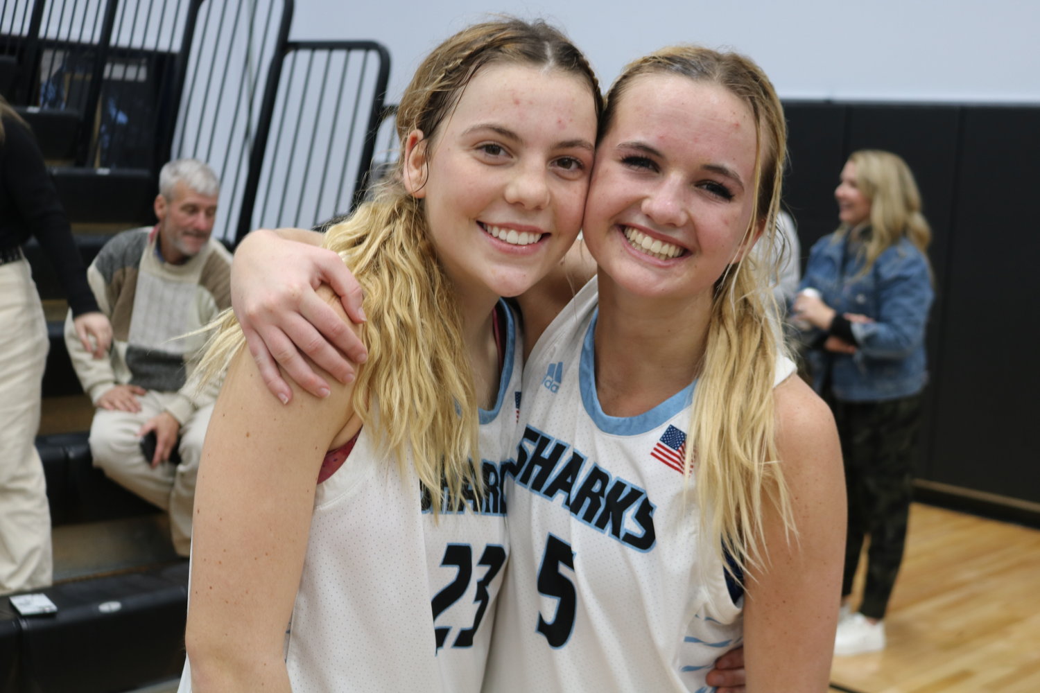 Ponte Vedra High seniors Paige Hulihan and Reeghan Mayer share an embrace on the court following a blowout win over Fletcher on senior night.